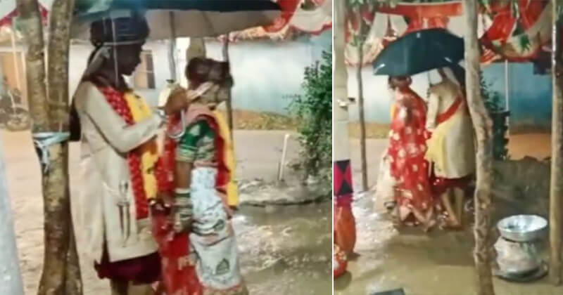 લો બોલો.. પરણવાનો ક્રેઝ તો જુઓ, ધોધમાર વરસાદમાં પણ હાથમાં છત્રી લઈને વર-કન્યા ફર્યા લગ્નના ફેરા, વીડિયો થયો વાયરલ